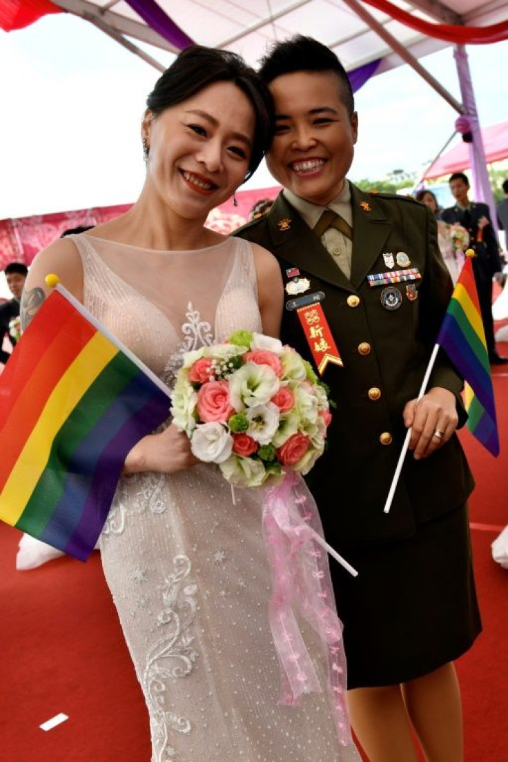 Yi Wang (R) and Yumi Meng were among the first same-sex couples to get married in a mass wedding held by the Taiwanese military