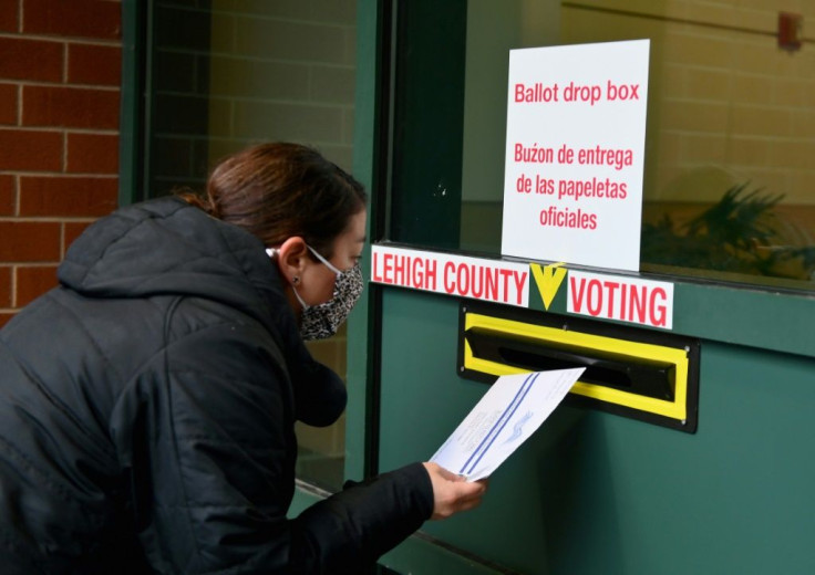 Americans, such as this voter in Pennsylvania, have been casting their ballots in record numbers ahead of the November 3, 2020 election