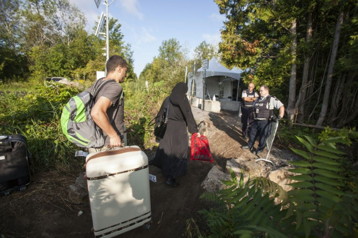 Canada announced it will offer permanent resident status to temporary foreign workers, international students and asylum claimants already in Canada, such as the family seen here crossing into Canada from the US in August 2017
