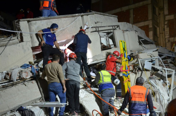 Rescuers search for survivors in a collapsed building in the Turkish city of Izmir after a powerful earthquake