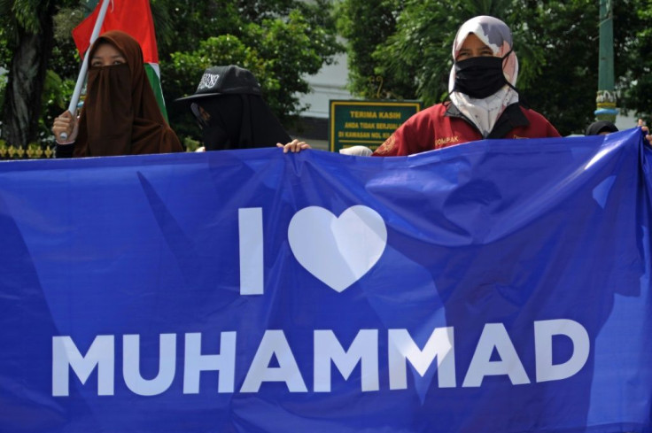 Muslims in Indonesia protest against French President Emmanuel Macron for his comments over the Prophet Mohammed caricatures