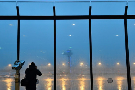After an embarrassing nine-year delay, Berlin's new international airport will finally welcome its first flights Saturday"Berlin Brandenburg Airport Willy Brandt" (BER) as rain falls on October 30, 2020 on the eve of its opening. Berlin's new internat