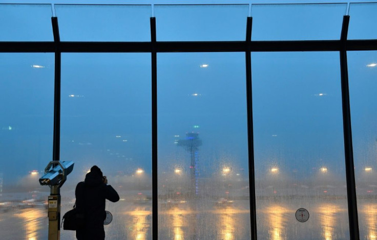 After an embarrassing nine-year delay, Berlin's new international airport will finally welcome its first flights Saturday"Berlin Brandenburg Airport Willy Brandt" (BER) as rain falls on October 30, 2020 on the eve of its opening. Berlin's new internat