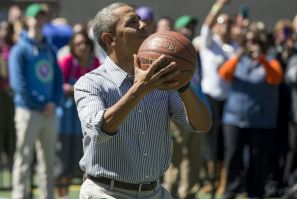 Then-president Barack Obama shoots a basketball at the White House in April 2014
