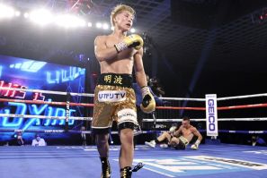 Japanese boxer Naoya Inoue walks to the corner after knocking down Australian challenger Jason Moloney during their bantamweight title bout at MGM hotel and casino in Las Vegas