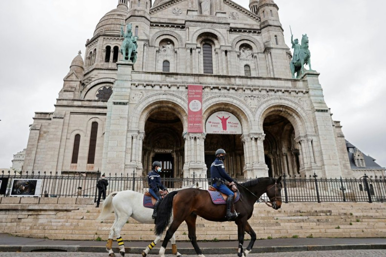 French mounted police patrolled in front of the Sacre-Coeur basilica during an All Saints' Day mass in Paris.