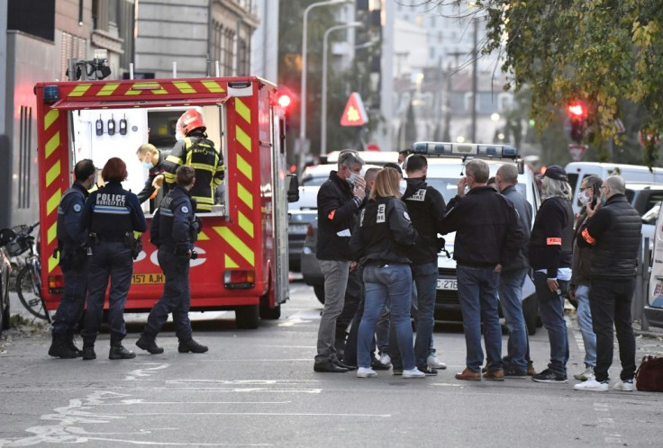 Security and emergency personnel on the scene of an attack targeting a Greek Orthodox priest in Lyon on Saturday.