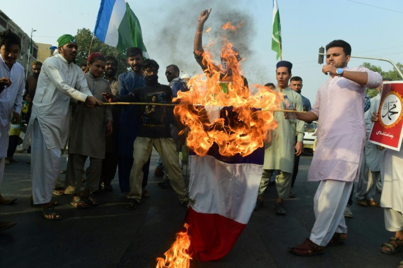 Protests against France continued on Sunday, with activists from an Islamic party seen here burning a French flag in Karachi, Pakistan.