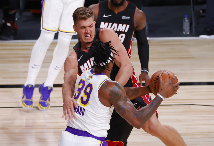 Dwight Howard #39 of the Los Angeles Lakers battles for the ball with Meyers Leonard #0 of the Miami Heat