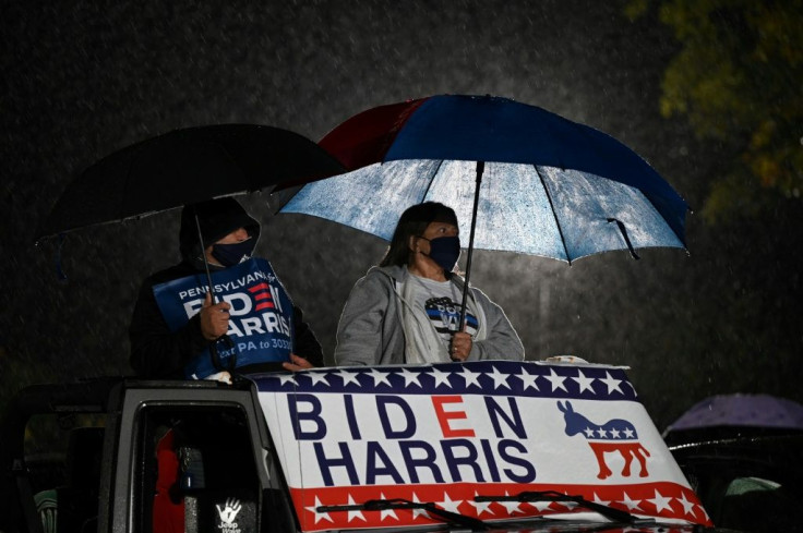 Supporters watch as Democratic presidential candidate Joe Biden speaks during a drive-in rally in Philadelphia, Pennsylvania, a state his campaign feels he must win if he is to defeat President Donald Trump on Tuesday