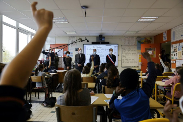 French Prime Minister Jean Castex and Education Minister Jean-Michel Blanquer travelled to Conflans-Sainte-Honorine, near Paris, to pay their respects to Samuel Paty