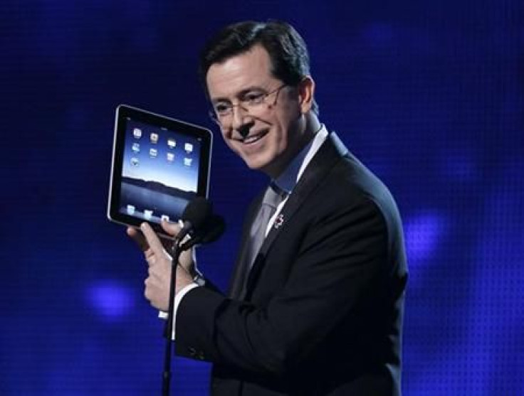 Stephen Colbert opens the show holding an Apple iPad at the 52nd annual Grammy Awards in Los Angeles