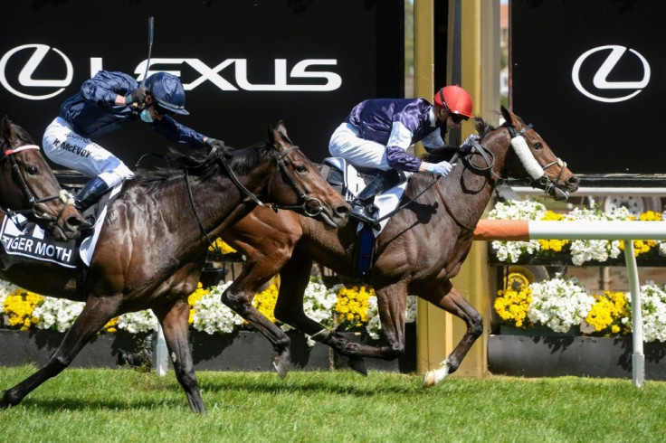 Twilight Payment (R) of Ireland, ridden by Jye McNeil, won the Melbourne Cup at Flemington