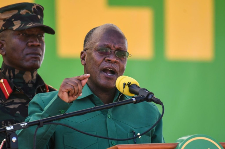 Tanzania's incumbent President and presidential candidate John Magufuli (R) speaks during the August 29 launch of his party's campaign for the October general election