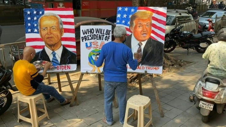Indian art school teachers paint images of US President Donald Trump and Democratic Presidential Candidate and former US Vice President Joe Biden ahead of the upcoming US presidential elections, outside an art school in Mumbai.