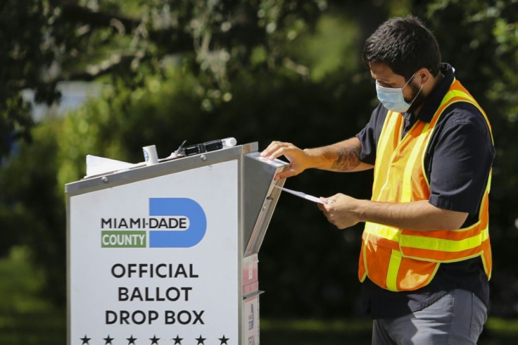 Voters began in-person balloting Tuesday after a tumultuous US election campaign and weeks of early and mail-in voting