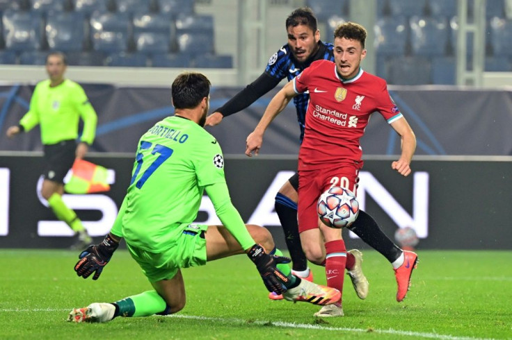 Diogo Jota finishes past Atalanta goalkeeper Marco Sportiello on his way to a hat-trick in Liverpool's 5-0 Champions League win on Tuesday