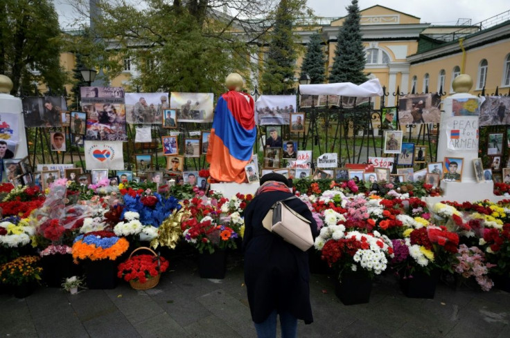A woman visits a makeshift memorial outside the Armenian embassy in Moscow for Armenians killed during the conflict over the breakaway region of Nagorno-Karabakh