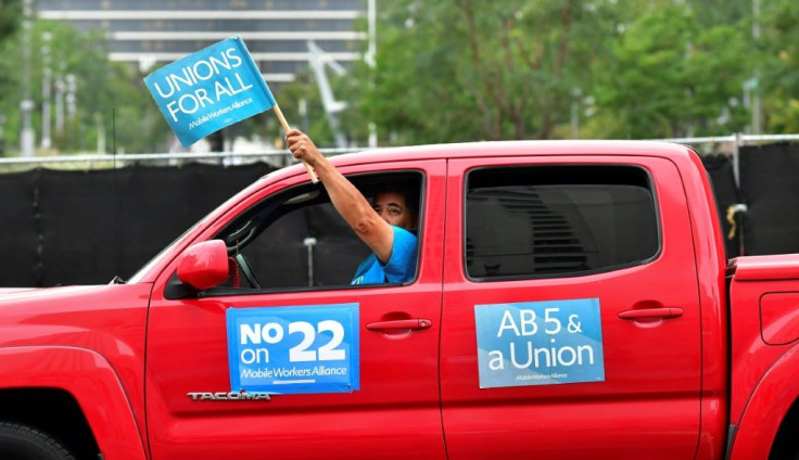 App-based drivers from Uber and Lyft protest in a caravan in Los Angeles