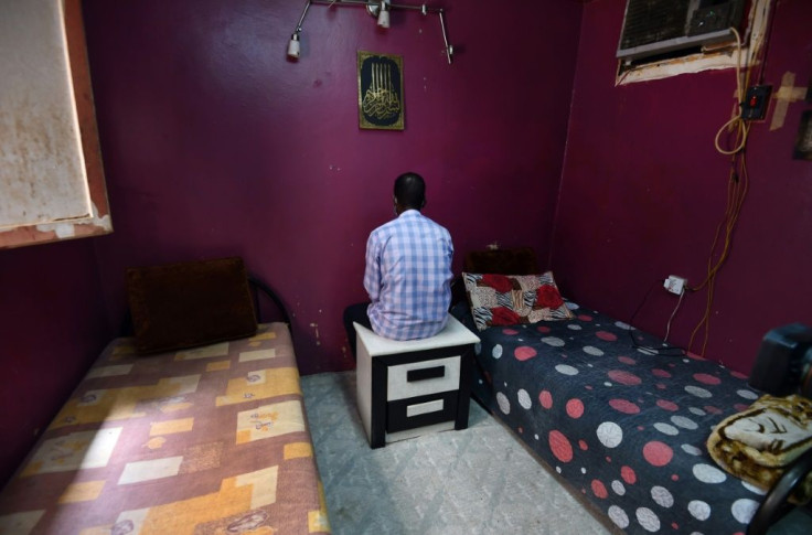 Mask-clad Sudanese electrician Hatem, a debt-ridden migrant worker in the Saudi capital with an expired residence permit, is photographed living in hiding in June for fear of arrest