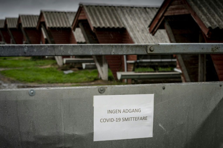 A sign in Danish language reads "No access -- risk of Covid-19 infection" at a mink farm in Hjorring, in North Jutland, Denmark (pictured October 2020)