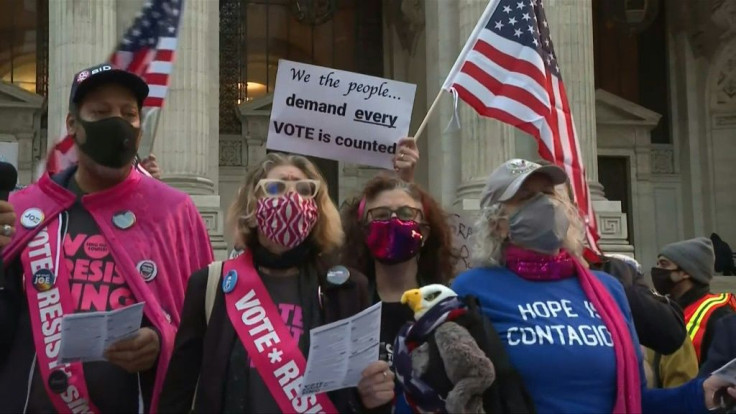 Protesters gather outside the New York Public Library near Bryant Park to demand that all votes be counted as the nation awaits the final results of the US election.
