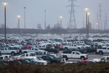 GM says it will bring back production of pickups at its Oshawa, Ontario assembly plant, which had been closed in December 2019. Hundreds of Silverado pickups assembled at the plant are seen here in November 2018 outside the facility
