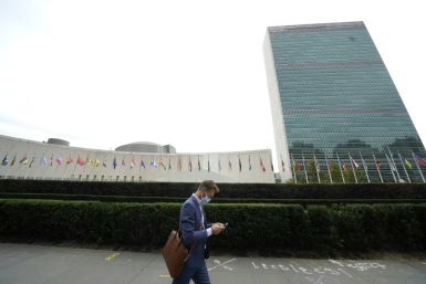 A man passes by the United Nations headquarters in New York in September 2020