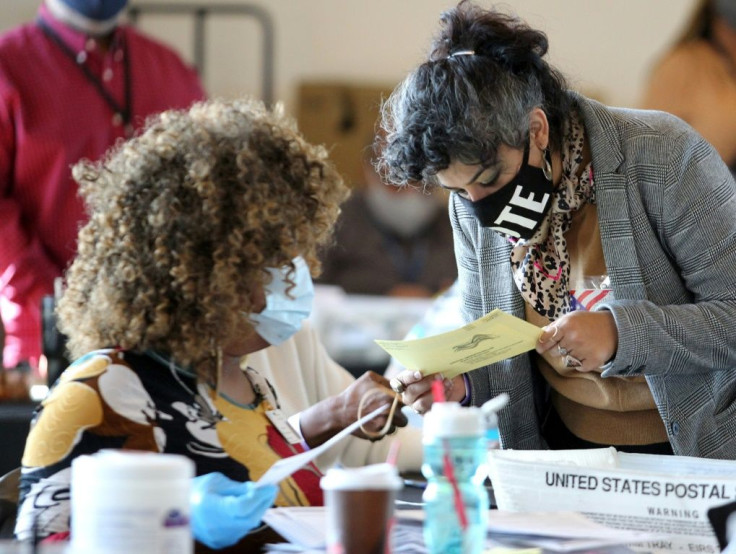 Election workers examine ballots while vote counting in Atlanta, Georgia