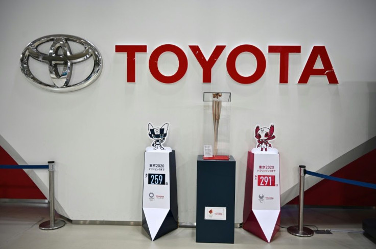 Toyota said it was revising up its sales and profit forecasts for the year as demand recovered qiucker than expected
