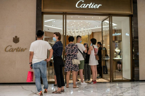 Plenty of people waiting to get into Cartier's store in Beijing in August -- as international tourism was choked off Chinese spent more on luxury items at home