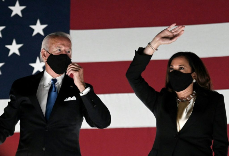 Former vice-president and Democratic presidential nominee Joe Biden (L) and Senator from California and Democratic vice presidential nominee Kamala Harris greet supporters outside the Chase Center in Wilmington, Delaware, at the conclusion of the Democrat