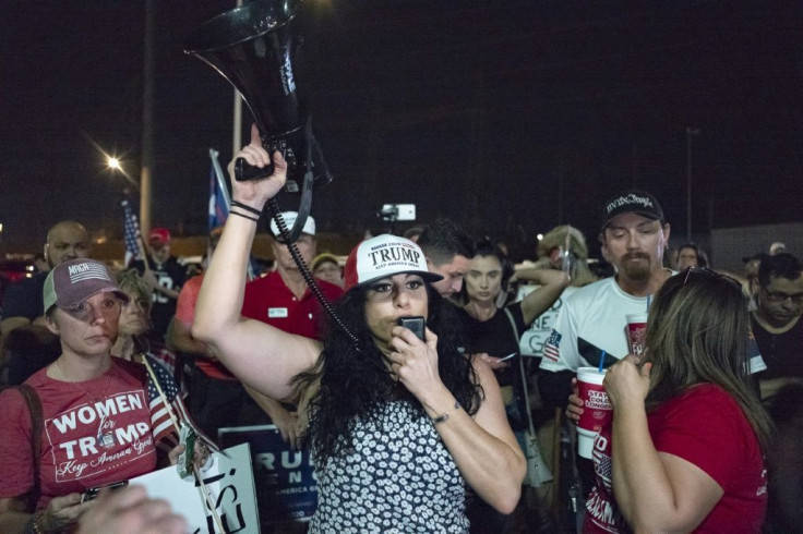 Supporters of President Donald Trump yell in anger after the election