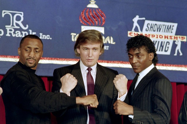 Donald Trump in 1990 with boxers Thomas 'The Hitman' Hearns and Michael 'The Silk' Olajide on the right