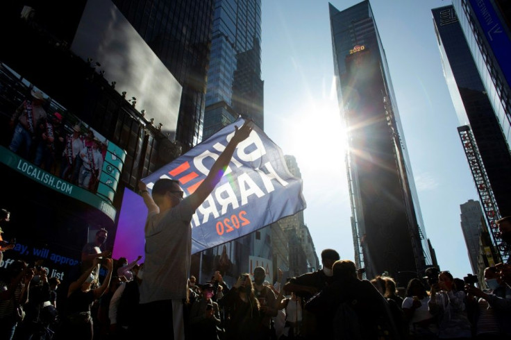 People celebrate at Times Square in New York after Joe Biden was declared winner of the 2020 presidential election on November 7, 2020.Democrat Joe Biden has won the White House, US media said November 7