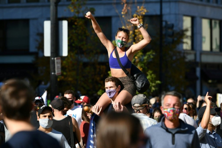 People celebrate Joe Biden's victory, on Black Lives Matter Plaza across from the White House