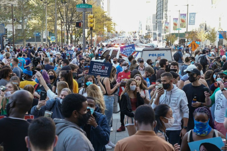 Celebrations erupt in Philadelphia, Pennsylvania, after Joe Biden is declared winner of the presidential election