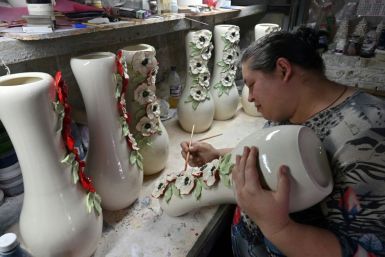 Maryna Novikova's ceramics workshop was thriving -- until the coronavirus pandemic hit, forcing staff layoffs and lower wages