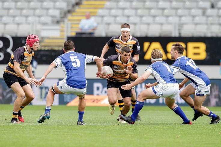 Nico Costa-Lidow of the Eden Lizards tries to evade the Auckland University Squids defence in the weight-restricted club final at Eden Park, the culmination of a competition that has been a huge hit with grassroots rugby players in New Zealand