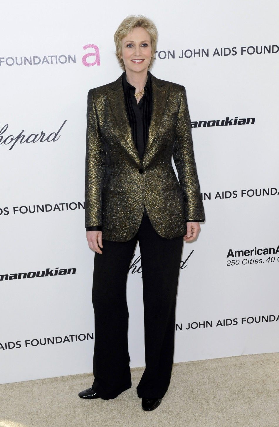 Actress Jane Lynch poses as she arrives at the 19th Annual Elton John AIDS Foundation Academy Award Viewing Party in West Hollywood, California February 27, 2011.