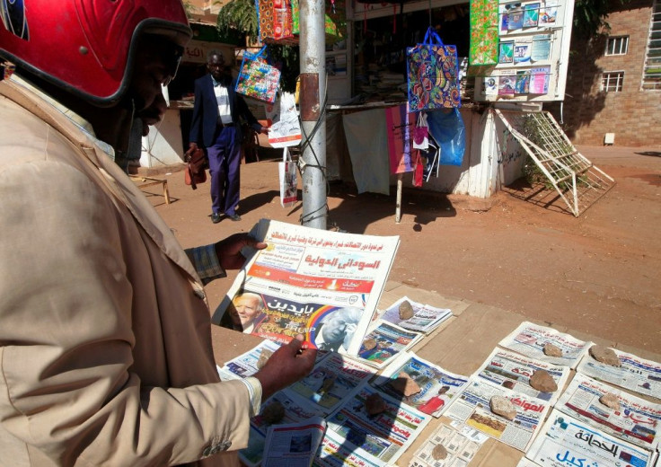 A man browses a newspaper in Sudan's capital Khartoum