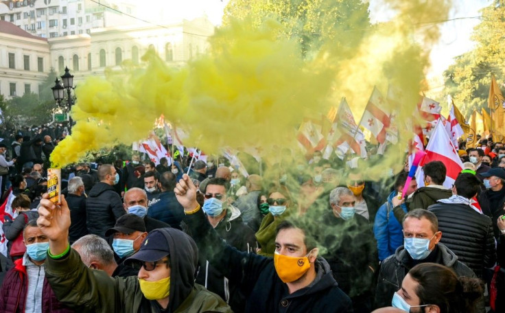 Thousands of Georgian opposition supporters rallied on Sunday against a ruling party accused of rigging legislative elections that it won narrowly a week ago.