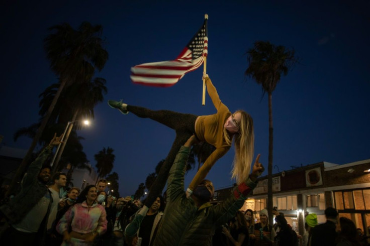 Supporters of Democrat Joe Biden support his victory in the US presidential race in Los Angeles