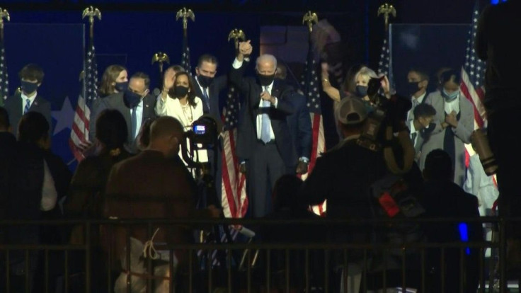 US President-elect Joe Biden and US Vice President-elect Kamala Harris give a victory speech followed by fireworks, in front of hundreds of supporters at a drive-in rally held outside the Chase Center in Wilmington, Biden's hometown in the state of Delawa