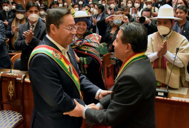 Luis Arce (L) and Vice President David Choquehuanca greet one another at a swearing-in before parliamentarians and foreign dignitaries in La Paz on November 8, 2020