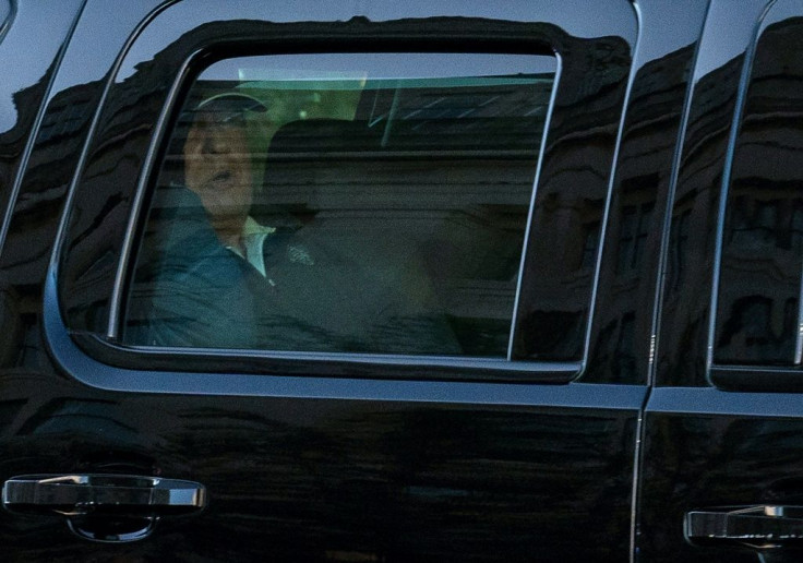 Donald Trump is seen in the presidential limousine as he returns to the White House on November 7, 2020 after a round of golf in Virginia