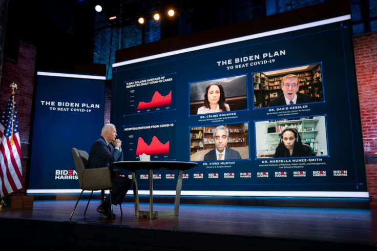 Joe Biden attends a coronavirus briefing on October 28, 2020 in Wilmington, Delaware, with participants in the briefing including two people he later named as co-chairs on his Covid-19 advisory board: Vivek Murthy and Marcella Nunez-Smith