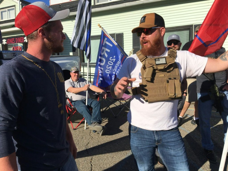 Eamon Daley (L), 28, and Aaron Dorman, 27, chat outside Jones Diner during a gathering of Trump supporters