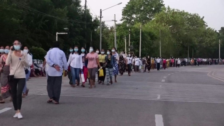 People in Myanmar's cities wait in long lines to vote