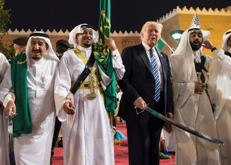 Donald Trump and Saudi Arabia's King Salman bin Abdulaziz al-Saud (L) dance with swords in the Saudi capital Riyadh during the US president's first visit to the kingdom soon after taking office